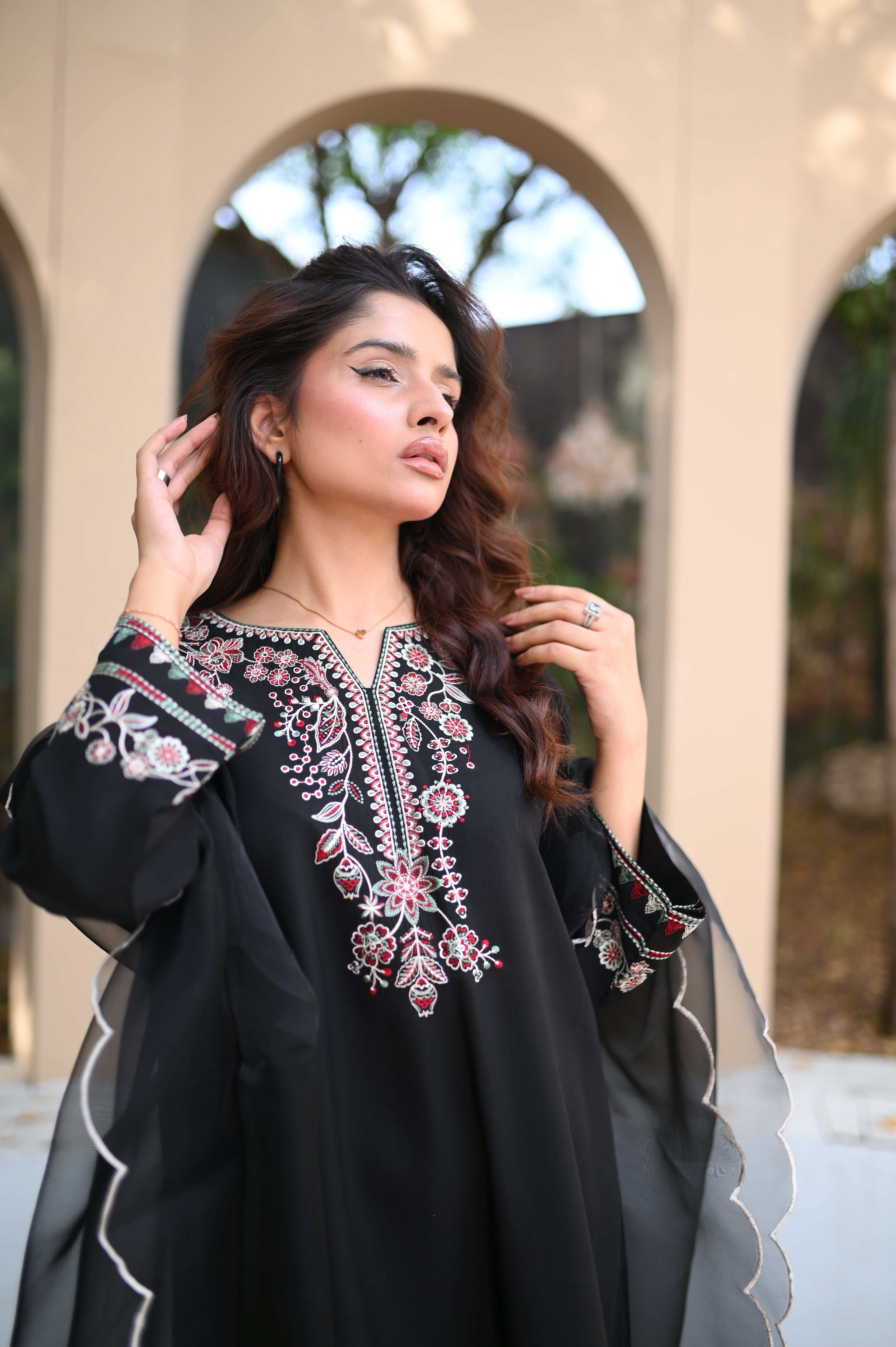 Noiré kaftan side slit and drape detail in black silk by ARSHAÉ